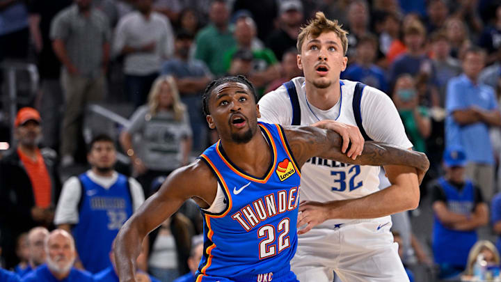Oct 6, 2025; Fort Worth, Texas, USA; Oklahoma City Thunder guard Cason Wallace (22) and Dallas Mavericks forward Cooper Flagg (32) during the game between the Dallas Mavericks and the Oklahoma City Thunder at Dickie's Arena. Mandatory Credit: Jerome Miron-Imagn Images