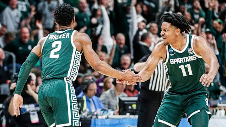 Michigan State guard Tyson Walker (2) celebrates a three point basket with guard A.J. Hoggard (11)