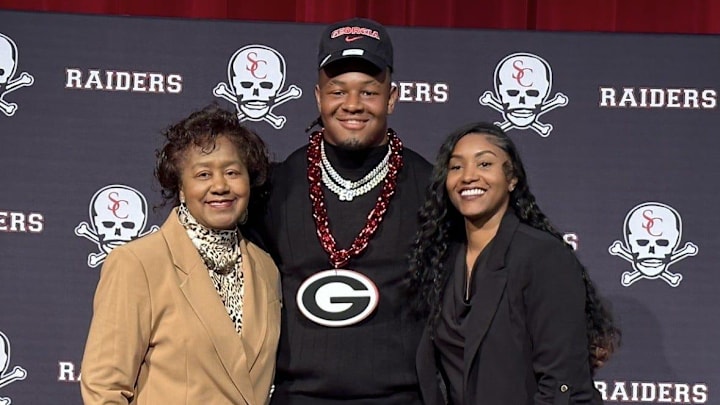 Elijah Griffin of Savannah Christian poses with his mother and grandmother in the SCPS gym after announcing his commitment to play football at Georgia on Oct. 18, 2023 Elijah Griffin of Savannah Christian poses with his mother and grandmother in the SCPS gym after announcing his commitment to play football at Georgia on Oct. 18, 2023