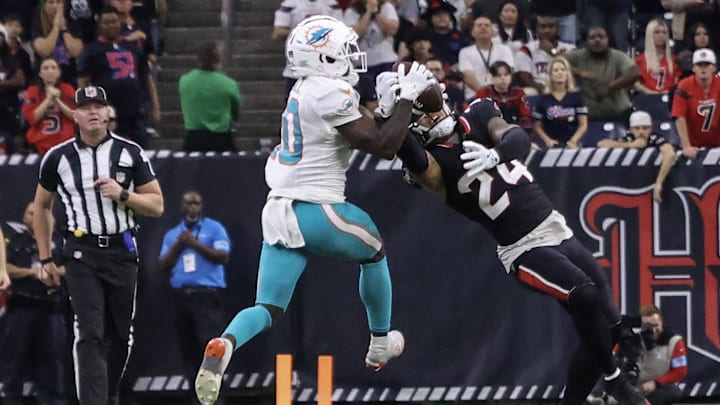 Houston Texans cornerback Derek Stingley Jr. (24) intercepts the ball against Miami Dolphins wide receiver Tyreek Hill (10) in the fourth quarter at NRG Stadium.