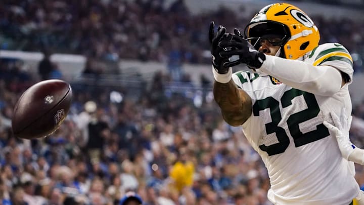 Green Bay Packers running back MarShawn Lloyd (32) and Indianapolis Colts cornerback Chris Lammons (38) miss a long pass on Saturday, Aug. 16, 2025, during a game against the Green Bay Packers at Lucas Oil Stadium in Indianapolis.