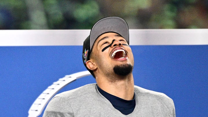 Jaxon Smith-Njigba of the Seattle Seahawks laughs