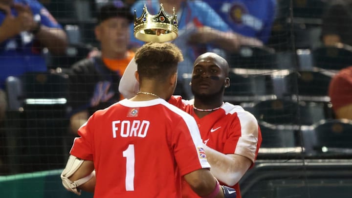 Great Britain catcher Harry Ford (1) is given a kings crown and robe by teammate Chavez Young after hitting a solo home run against Colombia in the seventh inning during the World Baseball Classic at Chase Field in 2023. Great Britain catcher Harry Ford (1) is given a kings crown and robe by teammate Chavez Young after hitting a solo home run against Colombia in the seventh inning during the World Baseball Classic at Chase Field in 2023.