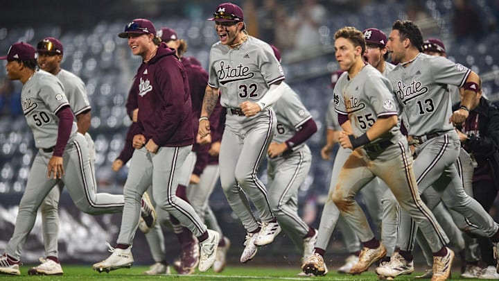 Mississippi State Bulldogs' players run back onto the field to celebrate after winning the game