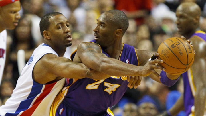 Nov 17, 2010; Auburn Hills, MI, USA;  Los Angeles Lakers shooting guard Kobe Bryant (24) is defended by Detroit Pistons shooting guard Tracy McGrady (1) during the game at The Palace. The Lakers defeated the Pistons 103-90. Mandatory Credit: Rick Osentoski-Imagn Images