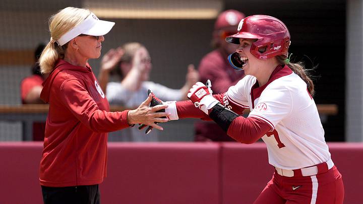 Oklahoma's Kasidi Pickering (7) celebrates a home run with head coach Patty Gasso in the third inning during Game 1 of the NCAA Norman Super Regional softball game between the Mississippi State Bulldogs and the University of Oklahoma Sooners at Love's Field in Norman, Okla., May, 22, 2026. Mississippi State won 11-9. Oklahoma's Kasidi Pickering (7) celebrates a home run with head coach Patty Gasso in the third inning during Game 1 of the NCAA Norman Super Regional softball game between the Mississippi State Bulldogs and the University of Oklahoma Sooners at Love's Field in Norman, Okla., May, 22, 2026. Mississippi State won 11-9.