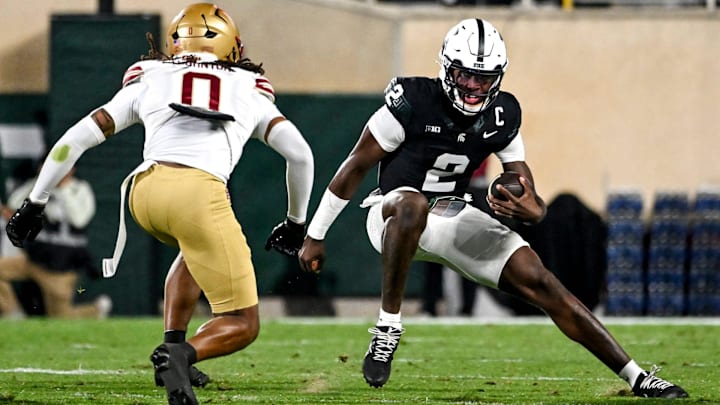Michigan State's Aidan Chiles, right, runs the ball as Boston College's Omar Thornton closes in during the second quarter on Saturday, Sept. 6, 2025, at Spartan Stadium in East Lansing.