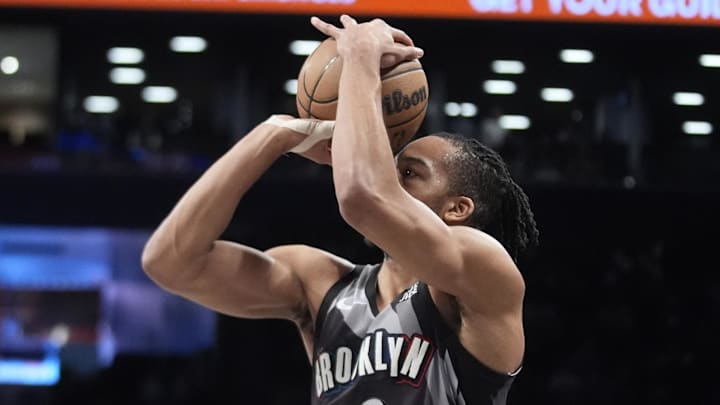 Apr 6, 2025; Brooklyn, New York, USA; Brooklyn Nets forward Tosan Evbuomwan (12) shoots a three point jump shot against the Toronto Raptors during the second half at Barclays Center. Mandatory Credit: Gregory Fisher-Imagn Images Apr 6, 2025; Brooklyn, New York, USA; Brooklyn Nets forward Tosan Evbuomwan (12) shoots a three point jump shot against the Toronto Raptors during the second half at Barclays Center. Mandatory Credit: Gregory Fisher-Imagn Images