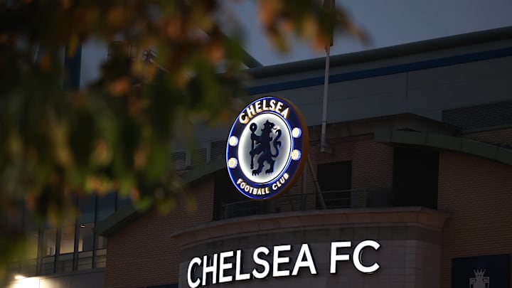 The Chelsea logo illuminates in the dark at Stamford Bridge.