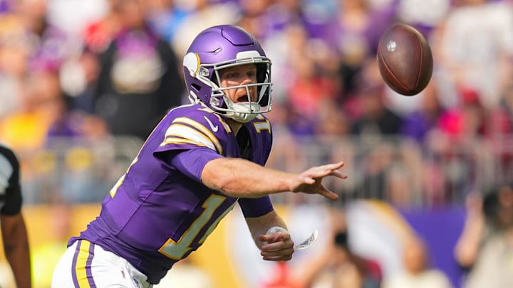 Minnesota Vikings quarterback Sam Darnold pitches the ball against the Houston Texans.