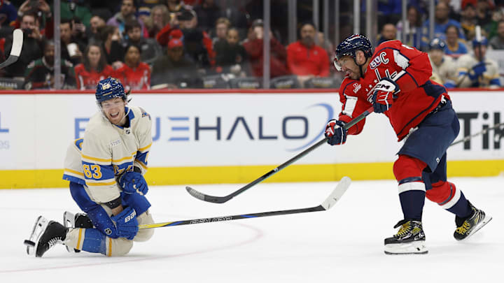 Feb 27, 2025; Washington, District of Columbia, USA; St. Louis Blues left wing Jake Neighbours (63) blocks a shot by Washington Capitals left wing Alex Ovechkin (8) in the third period at Capital One Arena. Mandatory Credit: Geoff Burke-Imagn Images