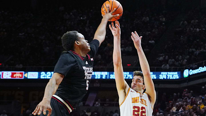 Iowa State Cyclones forward Milan Momcilovic (22) takes a three-point shot as Texas Tech Red Raiders forward Josiah Moseley (5) blocks during the second half in the Big-12 conference men’s basketball showdown on Feb. 28, 2026, at Hilton Coliseum in Ames, Iowa. Iowa State Cyclones forward Milan Momcilovic (22) takes a three-point shot as Texas Tech Red Raiders forward Josiah Moseley (5) blocks during the second half in the Big-12 conference men’s basketball showdown on Feb. 28, 2026, at Hilton Coliseum in Ames, Iowa.