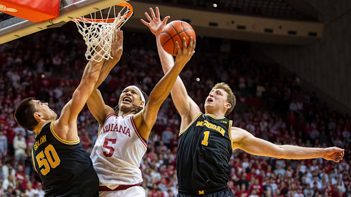 Indiana's Malik Reneau (5) scores between Valdislav Goldin (50) and Danny Wolf (1) during the Indiana versus Michigan mens basketball game at Simon Skjodt Assembly Hall on Saturday, Feb. 8, 2025. Indiana's Malik Reneau (5) scores between Valdislav Goldin (50) and Danny Wolf (1) during the Indiana versus Michigan mens basketball game at Simon Skjodt Assembly Hall on Saturday, Feb. 8, 2025.