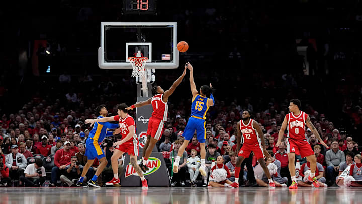 Ohio State Buckeyes guard Meechie Johnson Jr. (1) defends Pittsburgh Panthers guard Jaland Lowe (15) during the second half of the NCAA men's basketball game at Value City Arena in Columbus on Friday, Nov. 29, 2024. Ohio State lost 91-90 on a last second shot.