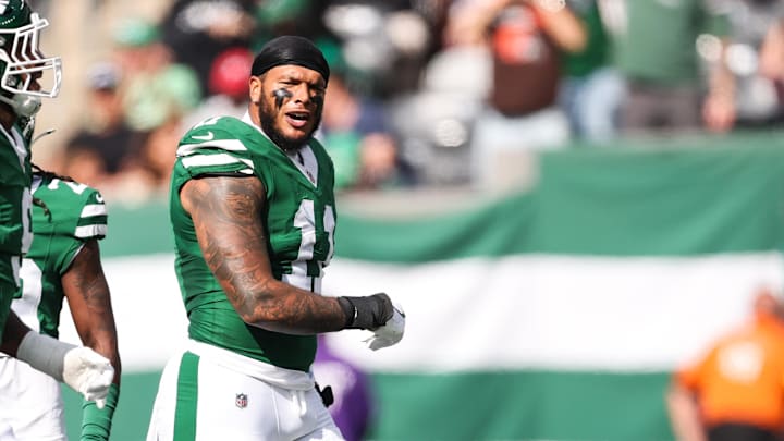 Oct 19, 2025; East Rutherford, New Jersey, USA; New York Jets linebacker Jermaine Johnson (11) celebrates a defensive stop in the first quarter against the Carolina Panthers at MetLife Stadium. Mandatory Credit: Vincent Carchietta-Imagn Images