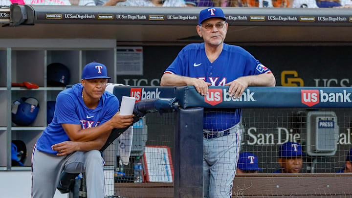 Jul 29, 2023; San Diego, California, USA; Texas Rangers manager Bruce Bochy (15) and associate manager Will Venable (83) watch on as San Diego Padres starting pitcher Yu Darvish (11) pitches during the fifth inning against the San Diego Padres at Petco Park. Mandatory Credit: David Frerker-Imagn Images