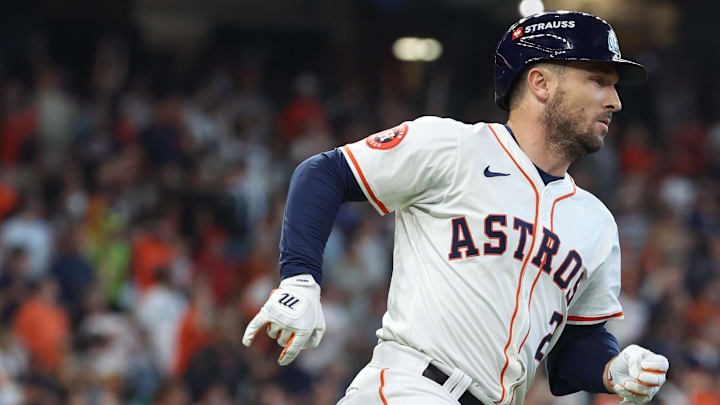 Oct 1, 2024; Houston, Texas, USA; Houston Astros third base Alex Bregman (2) hits a single against the Detroit Tigers in game one of the Wild Card round for the 2024 MLB Playoffs at Minute Maid Park. Mandatory Credit: Troy Taormina-Imagn Images