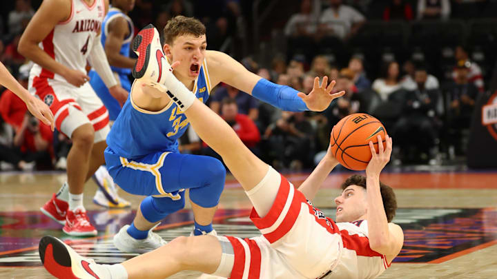 Dec 14, 2024; Phoenix, Arizona, USA; Arizona Wildcats guard Anthony Dell'Orso (3) grabs a loose ball against UCLA Bruins forward Tyler Bilodeau (34) in the second half at Footprint Center. Mandatory Credit: Mark J. Rebilas-Imagn Images Dec 14, 2024; Phoenix, Arizona, USA; Arizona Wildcats guard Anthony Dell'Orso (3) grabs a loose ball against UCLA Bruins forward Tyler Bilodeau (34) in the second half at Footprint Center. Mandatory Credit: Mark J. Rebilas-Imagn Images