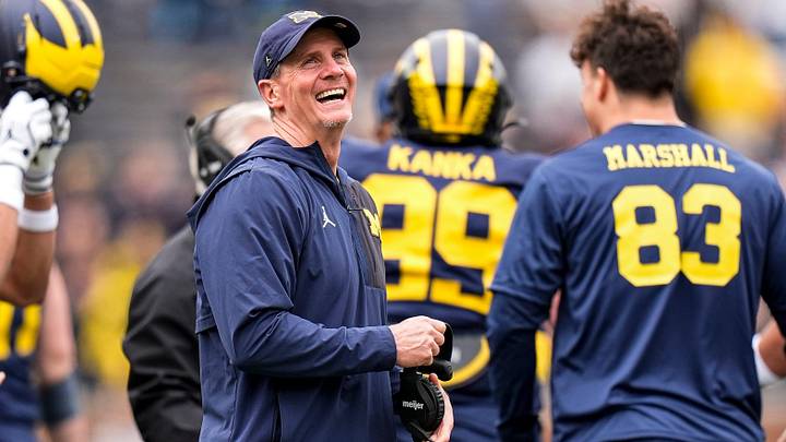 Michigan defensive coordinator Jay Hill celebrates a play during the spring game at Michigan Stadium Michigan defensive coordinator Jay Hill celebrates a play during the spring game at Michigan Stadium