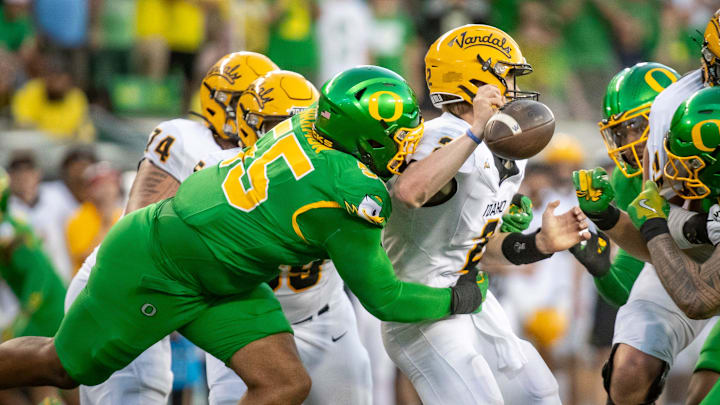 Oregon Ducks defensive lineman Derrick Harmon forces a fumble from Idaho Vandals quarterback Jack Layne as the Oregon Ducks host the Idaho Vandals Saturday, Aug. 31, 2024 at Autzen Stadium in Eugene, Ore.