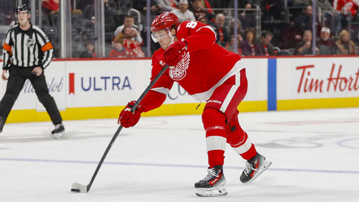 Jan 27, 2026; Detroit, Michigan, USA; Detroit Red Wings defenseman Moritz Seider (53) shoots the puck during the second period against the Los Angeles Kings at Little Caesars Arena. Mandatory Credit: Brian Bradshaw Sevald-Imagn Images