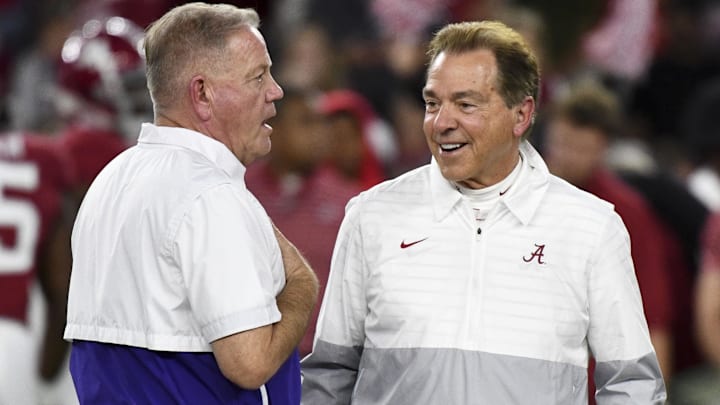 Nov 4, 2023; Tuscaloosa, Alabama, USA; LSU Tigers head coach Brian Kelly and Alabama Crimson Tide head coach Nick Saban talk together at midfield before the Alabama vs LSU game at Bryant-Denny Stadium. Mandatory Credit: Gary Cosby Jr.-Imagn Images Nov 4, 2023; Tuscaloosa, Alabama, USA; LSU Tigers head coach Brian Kelly and Alabama Crimson Tide head coach Nick Saban talk together at midfield before the Alabama vs LSU game at Bryant-Denny Stadium. Mandatory Credit: Gary Cosby Jr.-Imagn Images