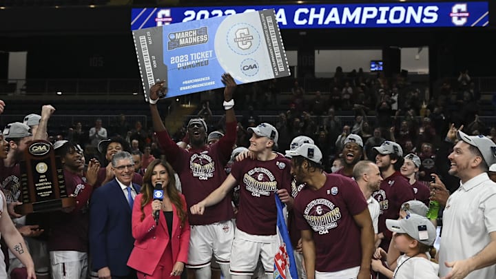 Mar 7, 2023; Washington, D.C., USA;  Charleston Cougars hoist their ticket to the 2023 March Madness tournament after defeating North Carolina-Wilmington Seahawks in the Colonial Athletic Association championship at Entertainment & Sports Arena. Mandatory Credit: Tommy Gilligan-Imagn Images