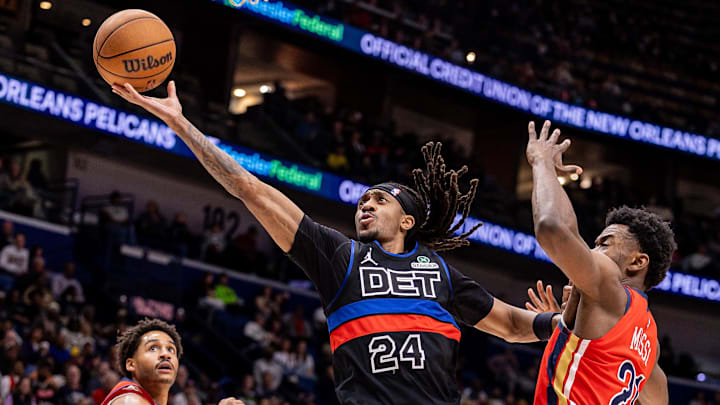 Jan 21, 2026; New Orleans, Louisiana, USA;  Detroit Pistons guard Daniss Jenkins (24) brings the ball up court against New Orleans Pelicans center Yves Missi (21) during the first half at Smoothie King Center. Mandatory Credit: Stephen Lew-Imagn Images