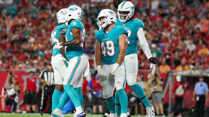 Miami Dolphins tight end Hayden Rucci (49) celebrates after scoring a touchdown against the Tampa Bay Buccaneers in the second quarter during preseason at Raymond James Stadium during the 2024 preseason. Miami Dolphins tight end Hayden Rucci (49) celebrates after scoring a touchdown against the Tampa Bay Buccaneers in the second quarter during preseason at Raymond James Stadium during the 2024 preseason.