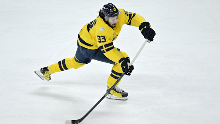 Feb 15, 2025; Montreal, Quebec, CAN; [Imagn Images direct customers only] Team Sweden forward Mika Zibanejad (93) plays the puck against Team Finland in the first period during a 4 Nations Face-Off ice hockey game at the Bell Centre. Mandatory Credit: Eric Bolte-Imagn Images