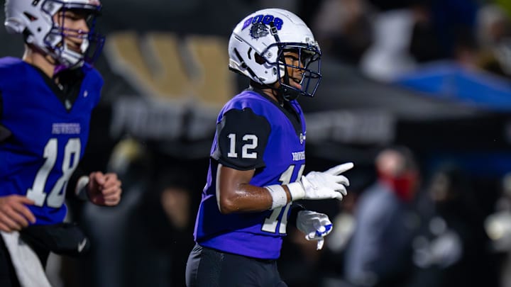 Brownsburg High School junior Branden Sharpe (12) reacts after a 4-yard touchdown run. Brownsburg High School junior Branden Sharpe (12) reacts after a 4-yard touchdown run.