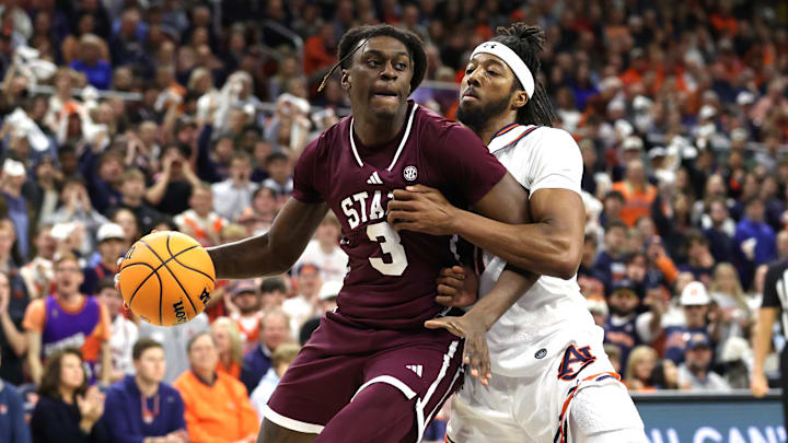 Jan 14, 2025; Auburn, Alabama, USA;  Mississippi State Bulldogs forward KeShawn Murphy (3) is pressured by Auburn Tigers forward Chaney Johnson (31) during the first half at Neville Arena. Mandatory Credit: John Reed-Imagn Images
