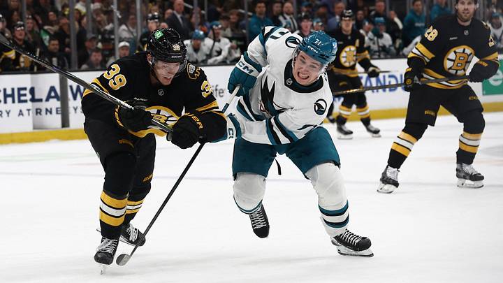 Mar 12, 2026; Boston, Massachusetts, USA; San Jose Sharks center Macklin Celebrini (71) and Boston Bruins center Morgan Geekie (39) eye a loose puck during the second period at TD Garden. Mandatory Credit: Winslow Townson-Imagn Images