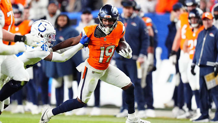 Indianapolis Colts cornerback Jaylon Jones (40) reaches for Denver Broncos wide receiver Marvin Mims Jr. (19) in the fourth quarter at Empower Field at Mile High. Indianapolis Colts cornerback Jaylon Jones (40) reaches for Denver Broncos wide receiver Marvin Mims Jr. (19) in the fourth quarter at Empower Field at Mile High.