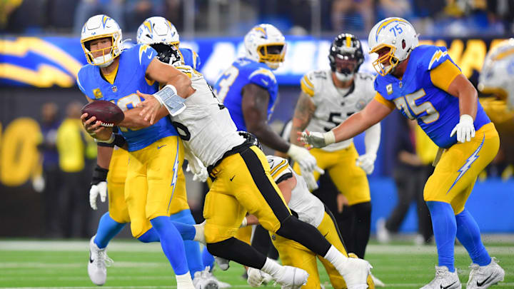 Nov 9, 2025; Inglewood, California, USA; Pittsburgh Steelers linebacker Alex Highsmith (56) sacks Los Angeles Chargers quarterback Justin Herbert (10) during the third quarter of the game at SoFi Stadium. Mandatory Credit: Gary A. Vasquez-Imagn Images