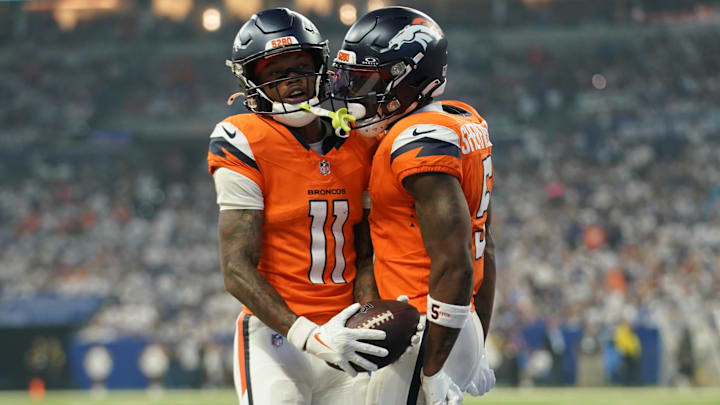 Sep 14, 2025; Indianapolis, Indiana, USA; Denver Broncos wide receiver Troy Franklin (11) celebrates scoring a touchdown with wide receiver Trent Sherfield Sr. (5) during the second quarter against the Indianapolis Colts   at Lucas Oil Stadium. 