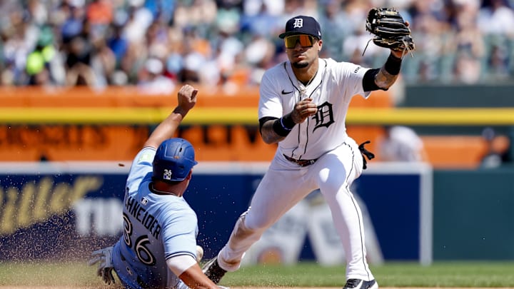Blue Jays outfielder Davis Schneider (left) and Detroit Tigers shortstop Javier Báez (right), during a 2025 game.