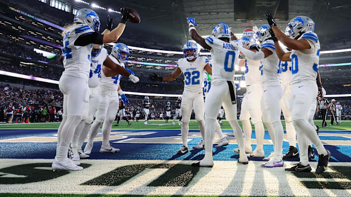 Oct 13, 2024; Arlington, Texas, USA; Detroit Lions safety Brian Branch (32) celebrates with teammates after making an interception during the second half against the Dallas Cowboys at AT&T Stadium. Mandatory Credit: Kevin Jairaj-Imagn Images Oct 13, 2024; Arlington, Texas, USA; Detroit Lions safety Brian Branch (32) celebrates with teammates after making an interception during the second half against the Dallas Cowboys at AT&T Stadium. Mandatory Credit: Kevin Jairaj-Imagn Images