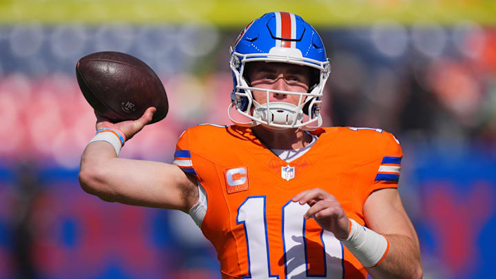 Oct 6, 2024; Denver, Colorado, USA; Denver Broncos quarterback Bo Nix (10) warms up before the game against the Las Vegas Raiders at Empower Field at Mile High. Mandatory Credit: Ron Chenoy-Imagn Images