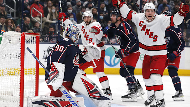 Jan 1, 2022; Columbus, Ohio, USA; Carolina Hurricanes right wing Nino Niederreiter (21) celebrates a goal by left wing Steven Lorentz (78) (not pictured) during the third period against the Columbus Blue Jackets at Nationwide Arena. Mandatory Credit: Russell LaBounty-Imagn Images