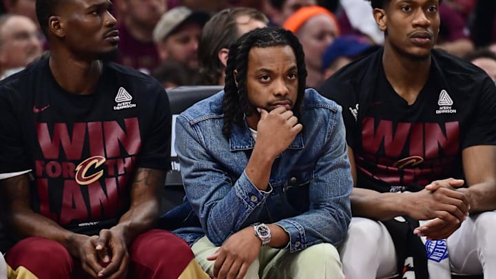 May 4, 2025; Cleveland, Ohio, USA; Cleveland Cavaliers guard Darius Garland, middle, watches from the bench during the first half against the Indiana Pacers in game one of the second round for the 2025 NBA Playoffs at Rocket Arena. Mandatory Credit: Ken Blaze-Imagn Images