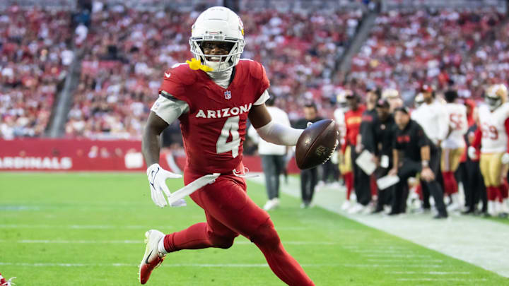 Jan 5, 2025; Glendale, Arizona, USA; Arizona Cardinals wide receiver Greg Dortch (4) scores a touchdown against the San Francisco 49ers in the second half at State Farm Stadium. Mandatory Credit: Mark J. Rebilas-Imagn Images Jan 5, 2025; Glendale, Arizona, USA; Arizona Cardinals wide receiver Greg Dortch (4) scores a touchdown against the San Francisco 49ers in the second half at State Farm Stadium. Mandatory Credit: Mark J. Rebilas-Imagn Images
