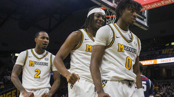 Nov. 8, 2024; Columbia, Missouri, USA; Missouri guards Tamar Bates, Marcus Allen and Anthony Robinson celebrate Robinson's dunk against Howard.