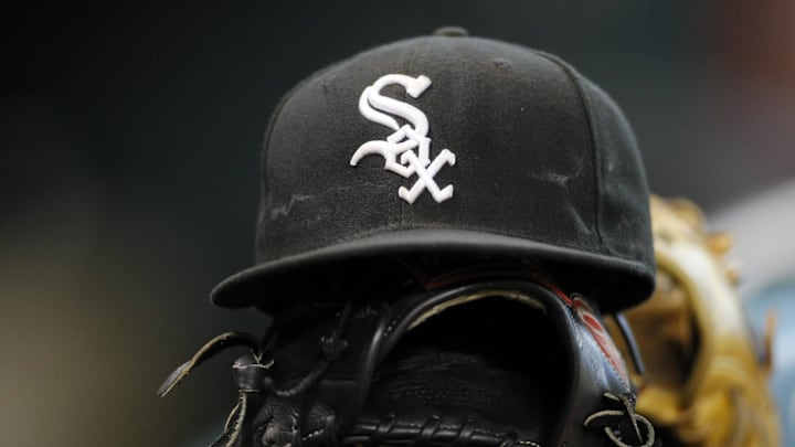 Detail view of a Chicago White Sox hat and glove on the bench before a game against the Houston Astros at Minute Maid Park. Mandatory Credit: Brett Davis-Imagn Images