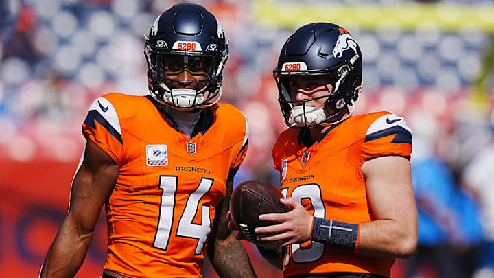Oct 13, 2024; Denver, Colorado, USA; Denver Broncos wide receiver Courtland Sutton (14) and quarterback Bo Nix (10) warm up before the game against the Los Angeles Chargers at Empower Field at Mile High. 
