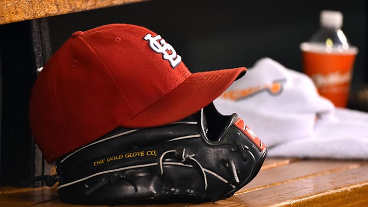 Aug 15, 2015; St. Louis, MO, USA; A detailed view of a baseball glove and St. Louis Cardinals hat in the dugout during the game between the Cardinals and the Miami Marlins at Busch Stadium. Mandatory Credit: Jasen Vinlove-Imagn Images Aug 15, 2015; St. Louis, MO, USA; A detailed view of a baseball glove and St. Louis Cardinals hat in the dugout during the game between the Cardinals and the Miami Marlins at Busch Stadium. Mandatory Credit: Jasen Vinlove-Imagn Images