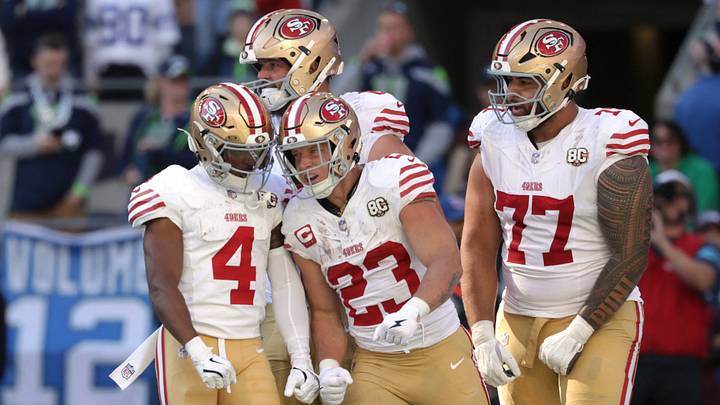 Oct 11, 2026; Seattle, Washington, USA; San Francisco 49ers running back Christian McCaffrey (23) celebrates with teammates after running for an eleven-yard touchdown against the Seattle Seahawks during the first half at Lumen Field. Mandatory Credit: Joe Nicholson-Imagn Images Oct 11, 2026; Seattle, Washington, USA; San Francisco 49ers running back Christian McCaffrey (23) celebrates with teammates after running for an eleven-yard touchdown against the Seattle Seahawks during the first half at Lumen Field. Mandatory Credit: Joe Nicholson-Imagn Images