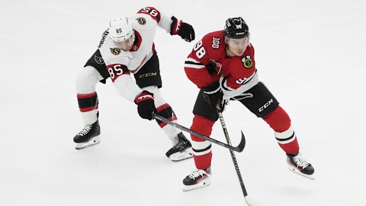 Oct 28, 2025; Chicago, Illinois, USA; Ottawa Senators defenseman Jake Sanderson (85) defends Chicago Blackhawks center Connor Bedard (98) during the first period at United Center. Mandatory Credit: David Banks-Imagn Images