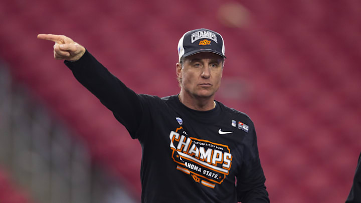 Jan 1, 2022; Glendale, Arizona, USA; Oklahoma State Cowboys head coach Mike Gundy celebrates after