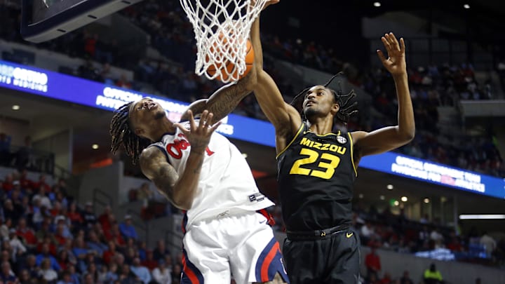 Feb 17, 2024; Oxford, Mississippi, USA; Mississippi Rebels guard Allen Flanigan (7) and Missouri Tigers forward Aidan Shaw (23) battle for a rebound during the first half at The Sandy and John Black Pavilion at Ole Miss. Mandatory Credit: Petre Thomas-Imagn Images Feb 17, 2024; Oxford, Mississippi, USA; Mississippi Rebels guard Allen Flanigan (7) and Missouri Tigers forward Aidan Shaw (23) battle for a rebound during the first half at The Sandy and John Black Pavilion at Ole Miss. Mandatory Credit: Petre Thomas-Imagn Images